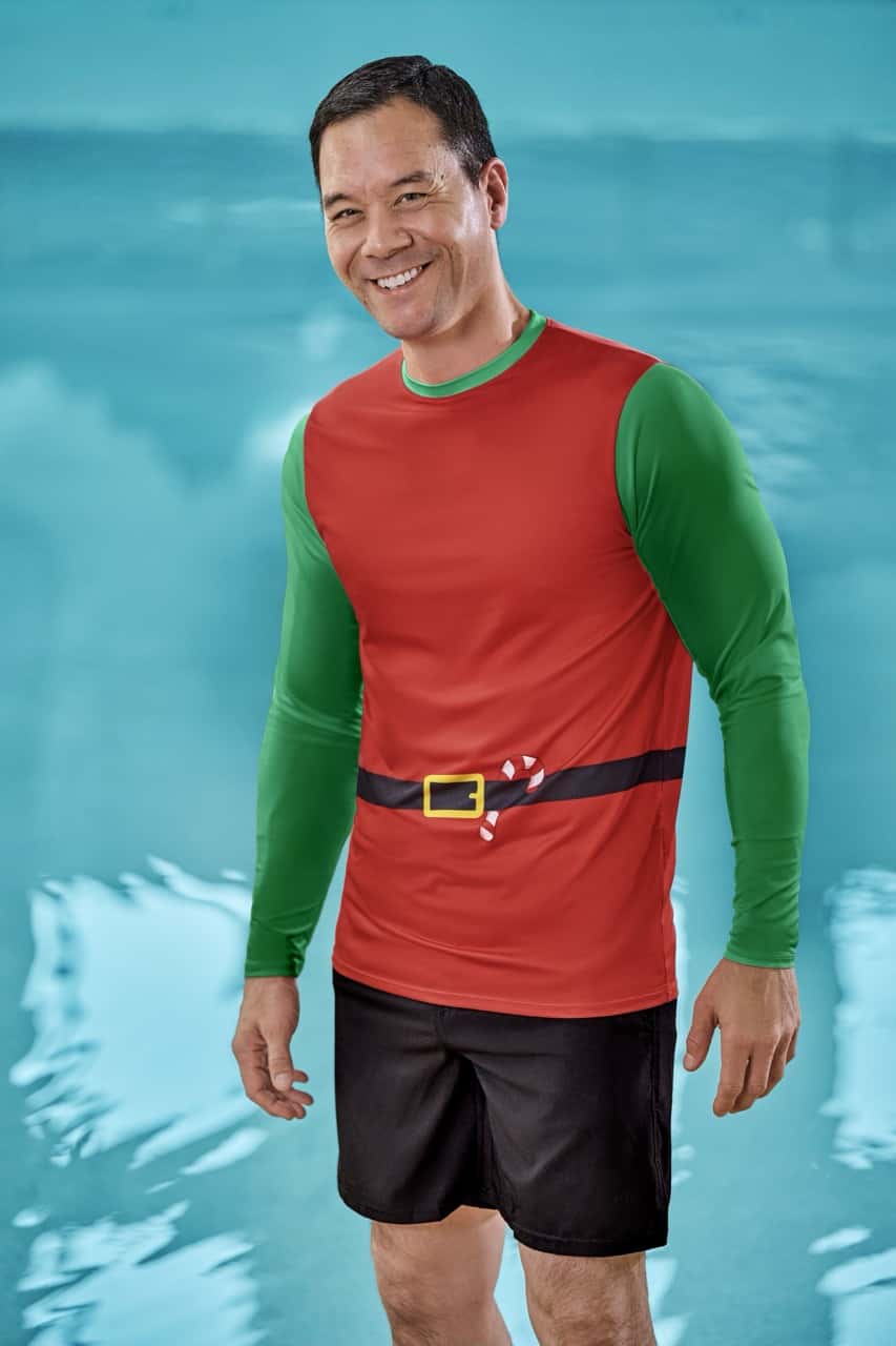 a man wearing a holiday themed elf swimwear